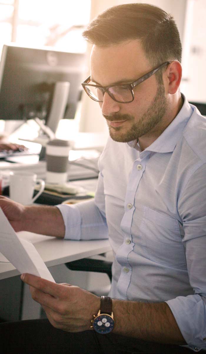 Employee in the office creating waste management strategies